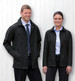 A men's and women's black soft shell jacket displayed on two models against a white wooden background. Each jacket features a logo.
