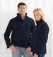Two models wear the Summit Jacket, a navy soft shell jacket, featuring a logo and front zip.