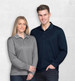A grey long sleeve polo shirt on a woman and a navy long sleeve polo shirt on a man. Both feature branding.