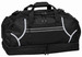 A black duffle bag with reflective accents and multiple zippered compartments, featuring sturdy handles and a logo.
