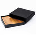 A black clamshell cheese board with a wooden interior, presented in an elegant black packaging.