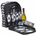 A picnic set featuring a black and white chevron bag, wine bottle, glassware, cutlery, and dinner plates.