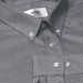 A button-up shirt in black and white check pattern with a brand label and white buttons.