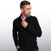 A black pullover sweater with a zip neckline, featuring a man adjusting the collar.