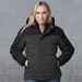 A woman wearing a black and grey smpli XT Plunge Jacket with a hood, featuring a logo on the chest.