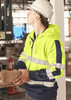 A bright yellow and navy unisex hoodie featuring reflective tape and a logo, worn by a person in a construction setting.