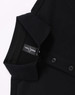 A black ultrafine cotton pique polo featuring buttons and a collar, with a visible brand label.