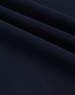 A close-up of navy ultrafine cotton pique fabric, showcasing its texture and weave.