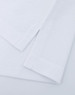 A Men's Ultrafine Cotton Pique Polo in white, featuring carefully stitched hems and a branded logo.