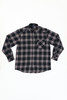 A long sleeve button-up shirt in black and grey plaid with a chest pocket and a logo.