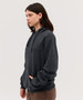 A dark grey hoodie with a front pocket and drawstring hood, featuring a brand logo.