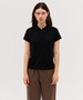 A black women's polo shirt with a collar, featuring a logo on the fabric, styled with short sleeves.