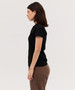 A side view of a black women's polo shirt, featuring a fitted design and short sleeves. It has a logo on the chest.