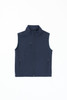 A navy blue softshell vest with a zip front and multiple zippered pockets. It features a high collar and has a logo.