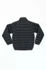 A black puffer jacket featuring a padded design and a collar, with a visible logo on the back.