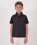 A youth black puffer vest with a zip front and two side pockets, featuring a logo on one side.