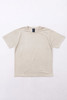 A beige essential t-shirt laid flat against a plain background, featuring a logo label at the neckline.