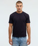 A dark navy essential tee displayed on a male model, paired with light blue denim jeans, featuring a simple design.