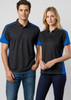 A black and blue women's short sleeve polo shirt with a branding logo, displayed on a model.