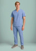 A model wearing light blue scrub cargo pants and a matching scrub top, featuring pockets and a logo.