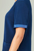 A navy blue unisex scrub top featuring short sleeves and a pocket, with a small metallic detail on the sleeve.
