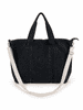 A black Brighton duffle bag with handles and an adjustable shoulder strap, featuring a logo on the side.