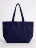 A navy blue canvas tote bag with two handles and a side pocket. It features a branding logo.