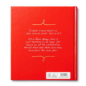 The back cover of the fill-in gift book for your special someone, I Wrote A Book About Us. The copy on the back reads, "I wrote a book about us. (Um. Spoiler alert. This is it.) It's a love story. And it just happens to be true. It's about all of the wonderful things that are here and real between me and you."