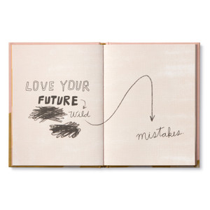 Inside of book open to page with the encouraging, uplifting statement: "Love your future wild mistakes." The page has a light background with an illustration of the copy and words scratche out.