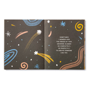Inside spread from "You Are Something Spectacular" has an out of this world pattern with shooting stars, planets and swirling designs. The page copy reads, "Sometimes I wonder how the forces of this universe aligned so completely, so perfectly, to create someone like you."