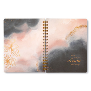 Inside this spiral notebook are 3 breakout pages with inspiring statements. This divider page features a pink and grey painterly background with gold foil flowers on the left page, and a statement on the right page that reads, "What will you dream into being?"