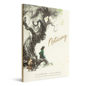 Angled, side view of the front cover of the children's book "Noticing", written by Kobi Yamada and illustrated by Elise Hurst. The jacket cover features an illustration of an old gnarly tree, and a girl and fox sitting beside the tree, with the title printed in gold foil.