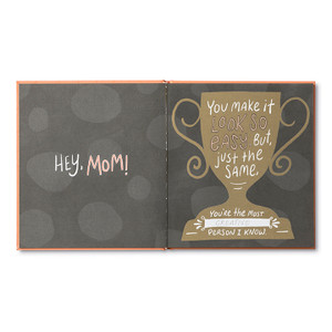 This page has a gray background, prompt, an illustration of a trophy and space to write. The copy reads, "Hey, Mom! You make it look so easy, but, just the same. You're the most ___________ person I know."