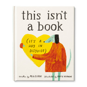 This image shows the front view of the gift book "This isn't a book, It's a Hug in Disguise". A bright and cheerful cover with an illustratation of a dog character in an orange sweater, hugging a large yellow heart. This book is written by M.H. Clark and illustrated by Katie Vernon.