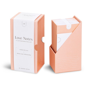 This image shows an open view of the letter writing kit "Love Notes". The gift box is open and the 20 themed notes are neatly tucked in the keepsake box with envelope covers. 