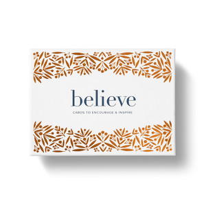 The front cover of the stationary box set, with the title "Believe" written in the center of the box, and a brown and white background. 