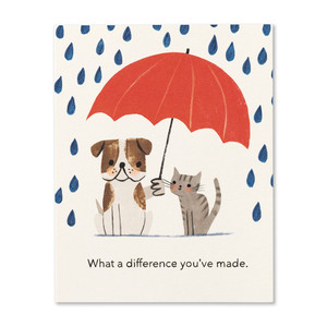 The front of this friendship card front features an illustration of a grey-striped cat and brown and white dog in the rain, the dog is holding a read umbrella over them, and the statement "What a difference you've made."