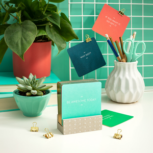 Lifestyle photo of the "Motto of the Day" card set. 76 inspiring cards that fit in a compact display. The cards shown in this photo read "If you want it, go get it", "Why not?" and "Be awesome today".