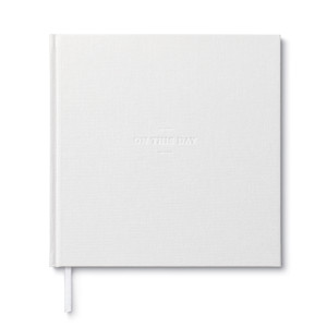 The front cover view of the wedding guest book, "On this Day". The cover is cloth white with the title debossed.