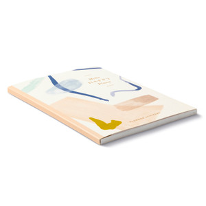 This angled view of the cover shows the sides of the sticker book, and the front cover. 