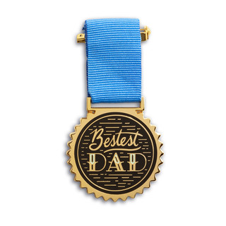 An award medal with a blue ribbon and an illustration that reads “Bestest Dad.”
