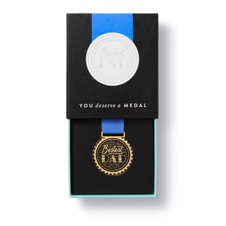 Half open box, showing half of the front of the medal. 