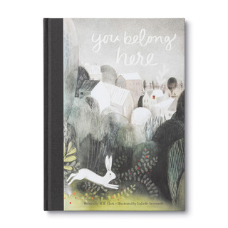 Front cover of the children's  book "You Belong Here" featuring two lions watching over a young boy, and a gray background. 