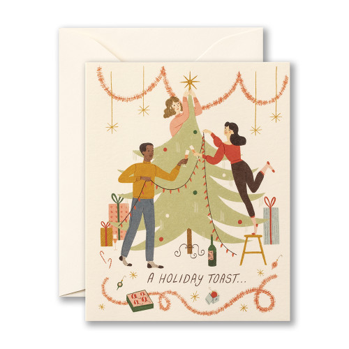 The front cover of this card features a white background, with people gathered around decorating a Christmas tree, and an envelope to go with the card. 
