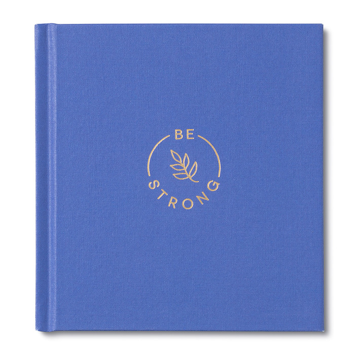 A blue hardcover encouragement book with the title Be Strong. The cover shows a leaf in gold foil. 