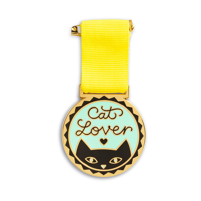 An award medal with a yellow ribbon and an illustration that reads “Cat Lover.”
