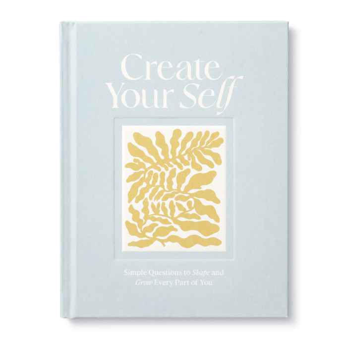 Front cover of "Create Your Self: Simple Questions to Shape and Grow Every Part of You" guided journal and activity book. Beautiful pale blue cover with gold leaf pattern in the center. 