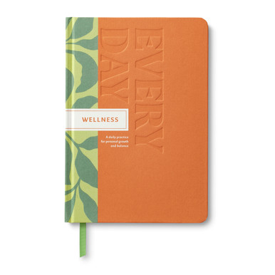 This image shows the front view of "Every Day Wellness", a daily practice guided journal for personal growth and balance. The cover design is an orange and green color block design.