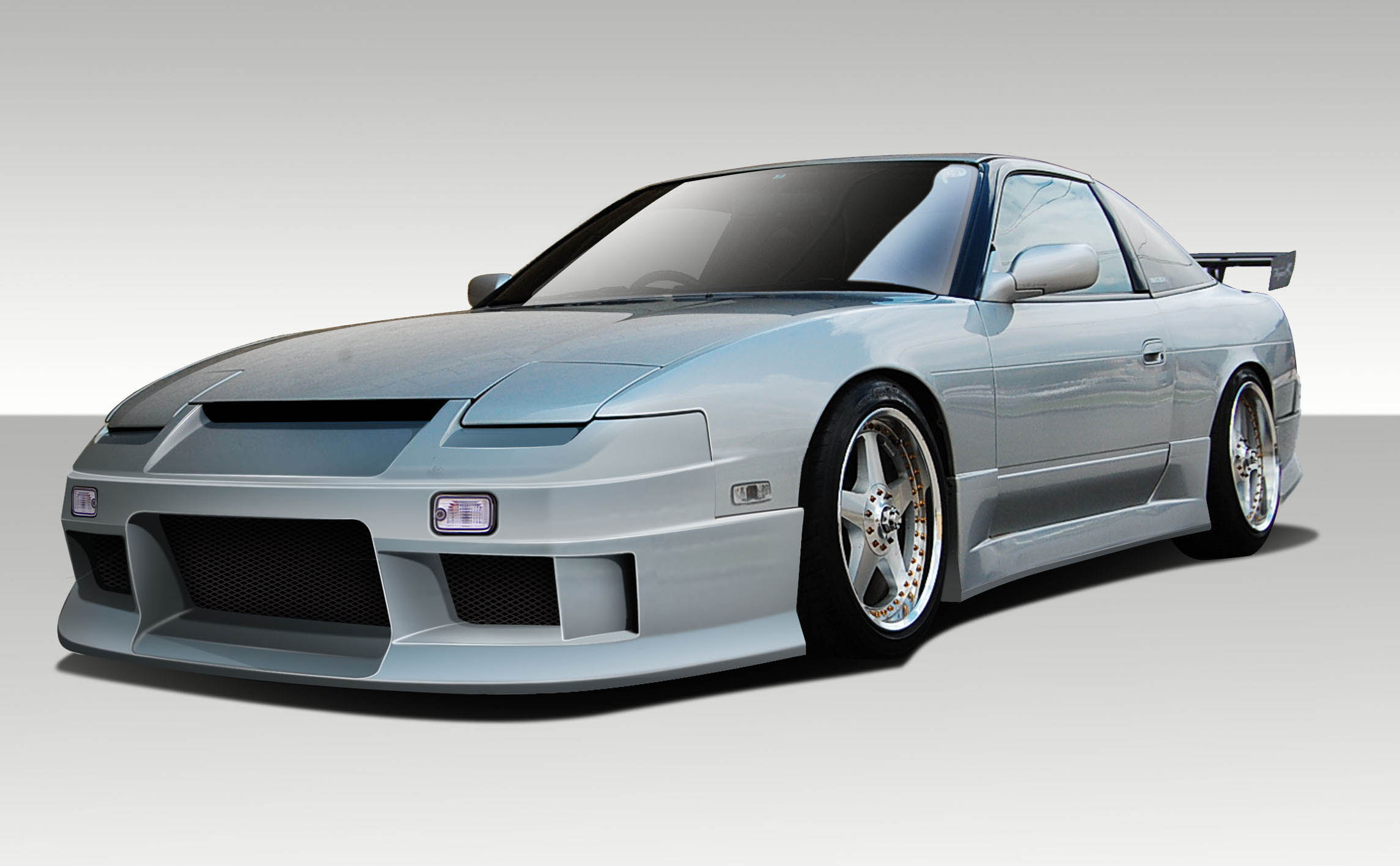 1989-1994 Nissan 240SX S13 2DR Duraflex Vector Body Kit - 4 Piece - Includes Vector Front Bumper Cover (109069) Vector Side Skirt Rocker Panels (109070) V-Speed Rear Bumper Cover (100853)