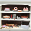 Against white background our 18 inch doll kitchen hutch shelves are stocked full with all of our  18 inch doll baked goods and baking tools.
